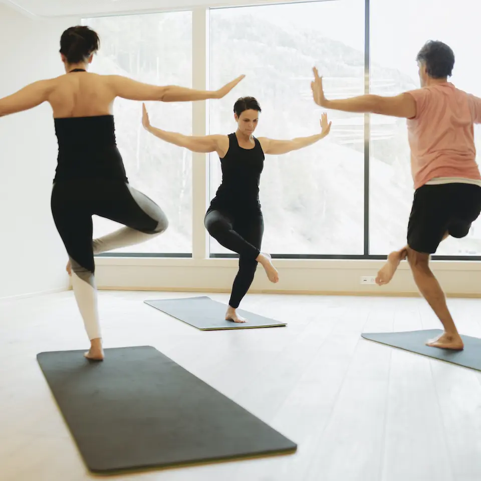 couple doing yoga on vacation